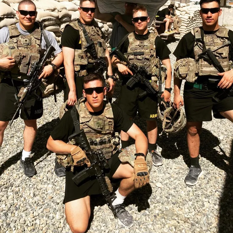 A group of military people holding guns